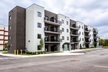 174 Trillium Way exterior photo of 174 Trillium Way, an affordable housing building with white and brown brick