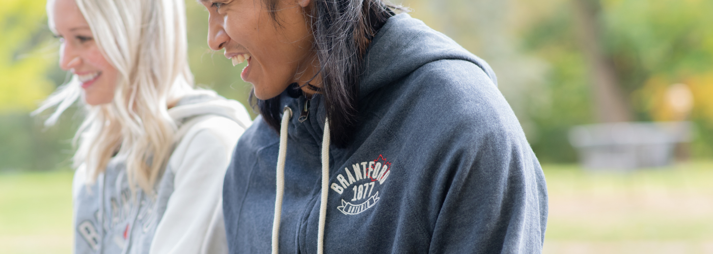 Two people wearing Brantford merchandise